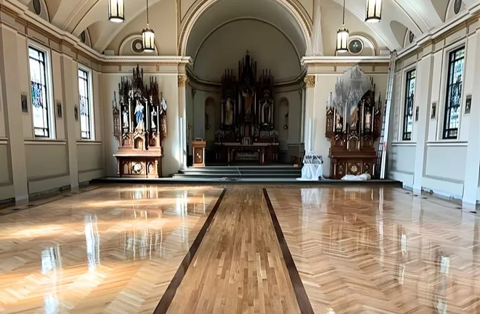 Hardwood flooring installation herringbone in grand hall 